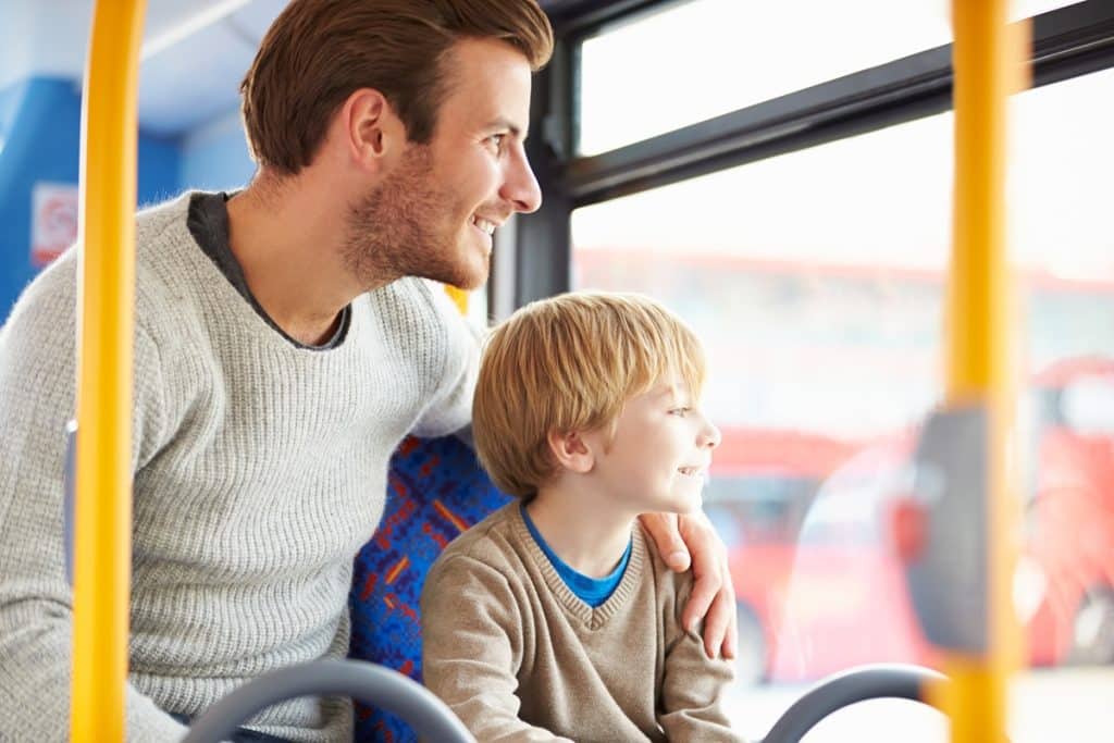 Father,And,Son,Enjoying,Bus,Journey,Together