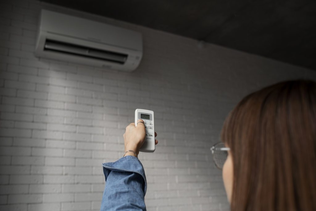 young woman using home technology